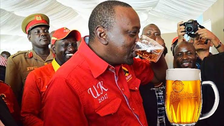 President Of Kenya H.E Uhuru Kenyatta gulping his favourite drink, beer.